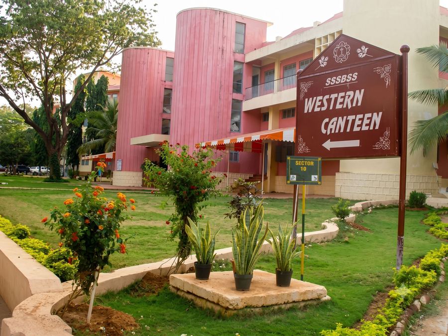 The Western Canteen sign before the pink Sector 10 building and gardens